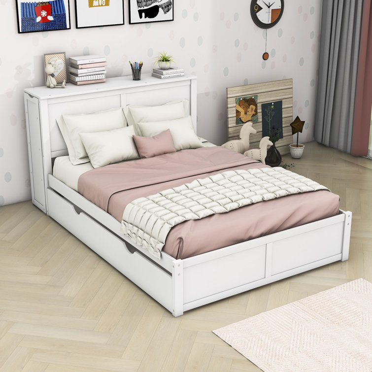 Full size bed with store twin pull out